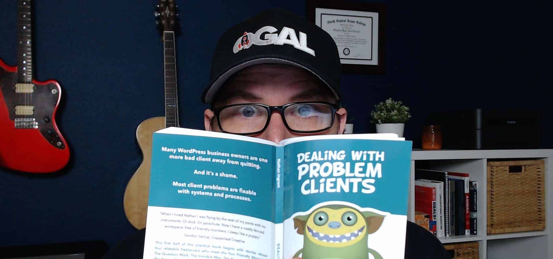 kyle reading the book dealing with problem clients