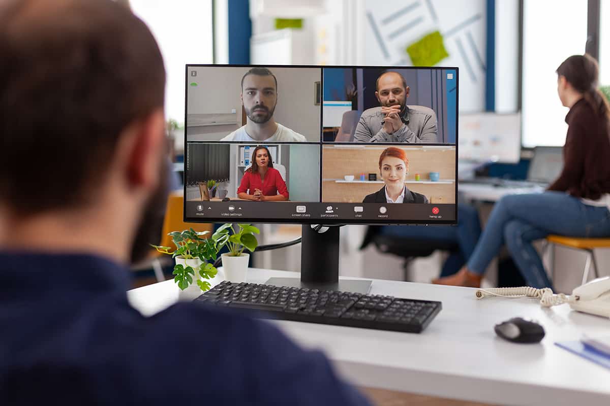 Businessman discussing with remote team planning company strategy together