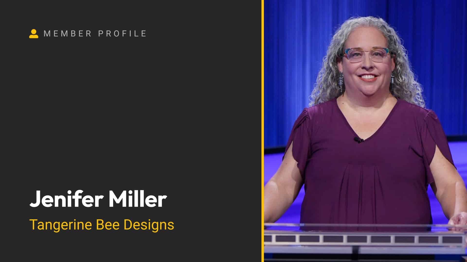 Jenifer Miller smiling on stage with a blue curtain background.